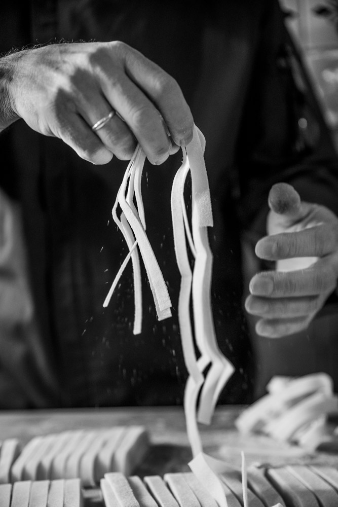 Hands making classic Italian food
